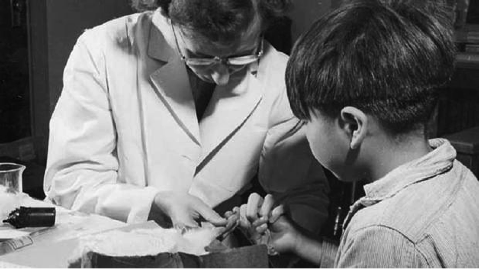 A nurse takes a blood sample from an Indigenous child for nutritional experiments, Port Alberni, BC, 1948